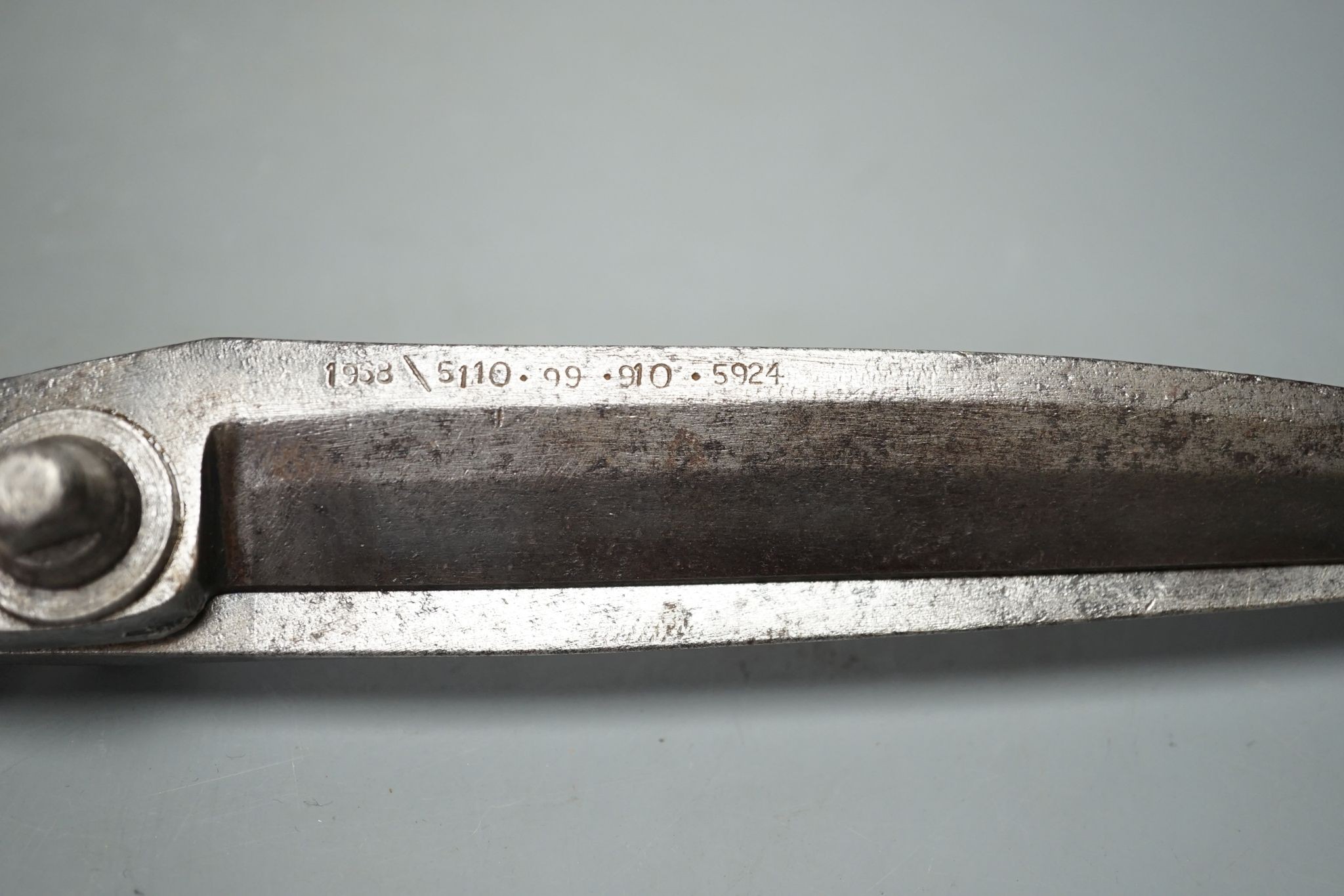 A pair of over-sized tailor’s scissors, one blade stamped ‘1938 \ 5110.99.910.5934’